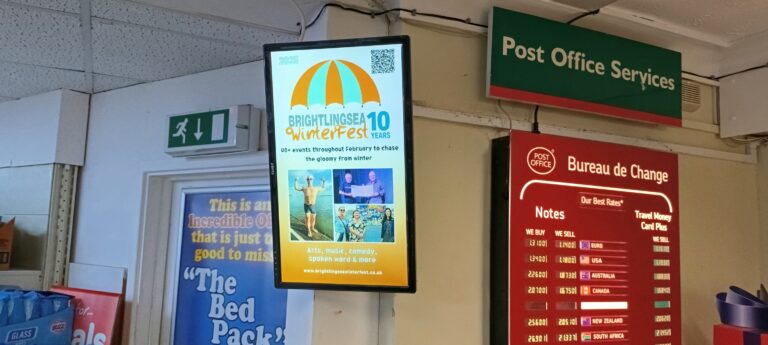 a digital advertising screen in he post office advertising Winterfest